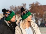 couple presenting black folk beanies with lowicz roosters pattern