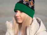 folk beanie with lowicz roosters pattern on a model