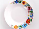 Folk plate for soup, decorated with colorful Lowicz flowers. Part of a set of 18 pieces.