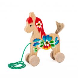 A toy horse on wheels, large - red mane