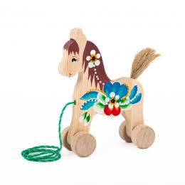 A toy horse on wheels, large - brown mane
