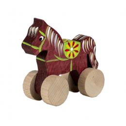 A small carved horse on wheels - brown